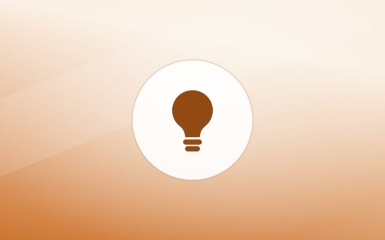 Illustration of a lightbulb on a warm background
