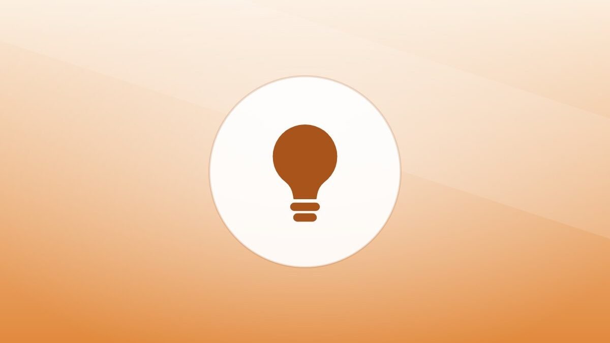 Illustration of a lightbulb on a warm background