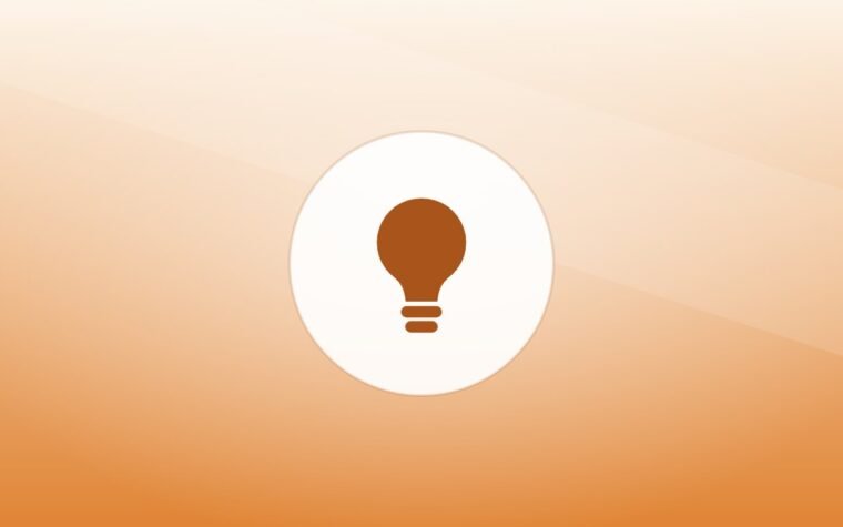 Illustration of a lightbulb on a warm background