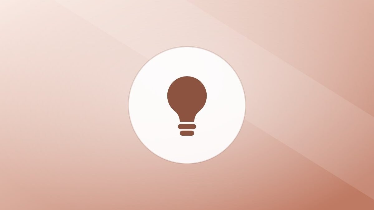 Illustration of a lightbulb on a warm background