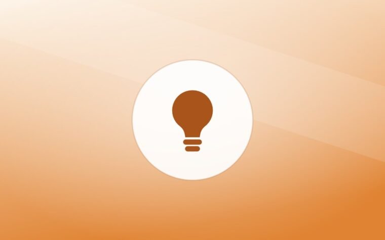Illustration of a lightbulb on a warm background