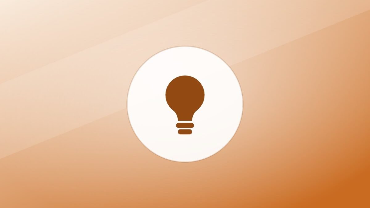 Illustration of a lightbulb on a warm background