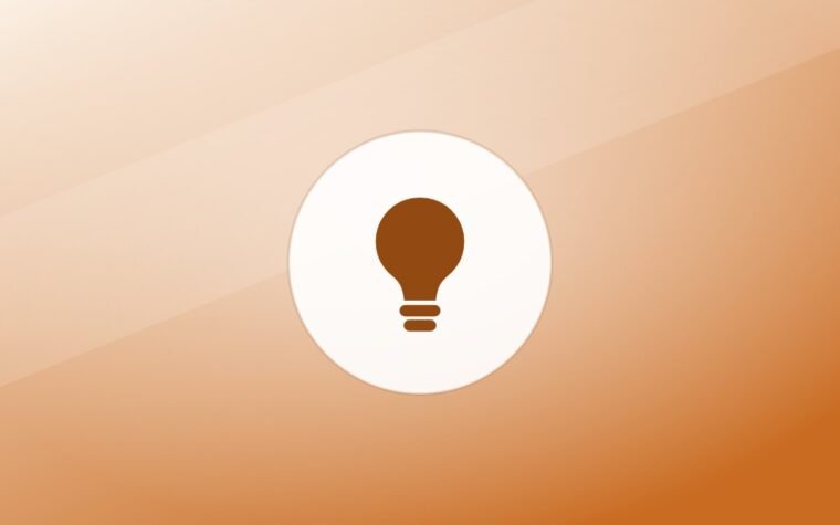 Illustration of a lightbulb on a warm background
