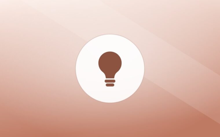 Illustration of a lightbulb on a warm background